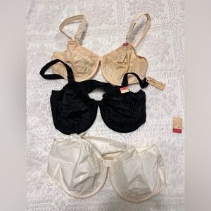 Three vintage Goddess bullet bras never worn.